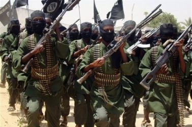 In this photo taken Thursday Feb.17, 2011 Al-Shabab fighters march with their guns during military exercises on the outskirts of Mogadishu,Somalia (AP)