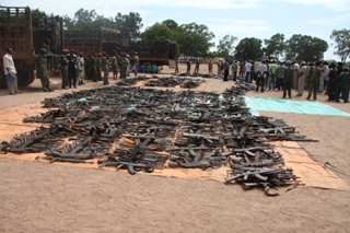 The SPLA displaying firearms in Rumbek's Freedom Square from a disarmament campaign in Lakes state. (ST)