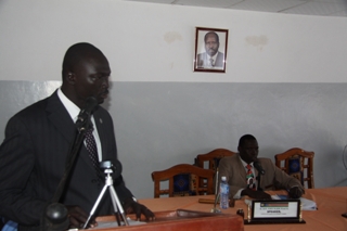 Rumbek East Commissioner, David Marial Gumke, address the Lakes state parliament in South Sudan, while being watched by speaker J­ohn Marik (Right), 23 Dec. 2011 (ST)sitted