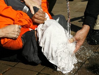 Demonstrator Maboud Ebrahimzadeh is held down during a simulation of waterboarding outside the Justice Department in Washington in this November 5, 2007  (file photo./Reuters)