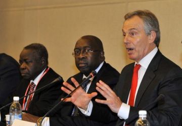 Former British PM Tony Blair (R), who leads a panel discussion on aid to Africa, speaks as Liberian Minister of Economic Affairs Amara Konneh (L), South Sudanese Minister of Finance Kosti Manibe Ngai (2nd L), listen during a forum on the sidelines of the Fourth High Level Forum on Aid Effectiveness in the southeastern port city of Busan on November 29, 2011. (Getty)