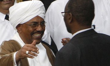 FILE - Sudanese president Omer Hassan al-Bashir, left, moves to embrace Khalil Ibrahim, leader of the rebel Justice and Equality Movement (JEM) in Doha February 24, 2010 (Reuters)