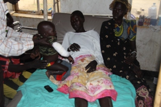 Wounded woman and her child at Jale payam in Bor county. Dec. 7, 2011 (ST)