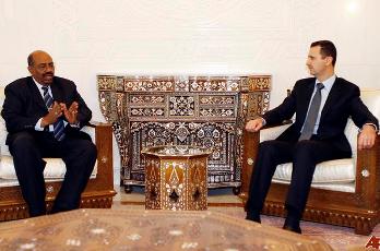 FILE - Syrian President Bashar Assad, right, meets with his Sudanese counterpart Omar al-Bashir (AP Photo/Bassem Tellawi)