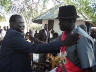 Twic East County Commissioner Dau Akooi Jurkuch (L) is congratulated by one of the traditional chiefs (R) in Panyagor. Jan. 7, 2012 (ST)