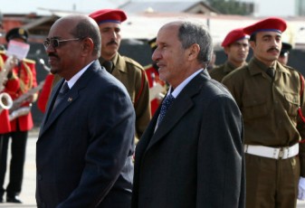 Libya's NTC chief Mustafa Abdel Jalil (R) and Omar al-Bashir (L) during a welcoming ceremony in Tripoli on January 07 (AFP-GETTY IMAGES)