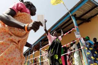 South Sudanese women celebrate casting their votes (Reuters)