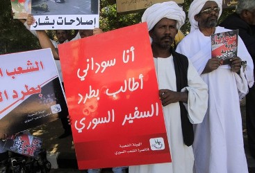 Sudanese and Syrian protesters demonstrate against the continued violence in Syria outside Sudan's Ministry of Foreign Affairs in Khartoum November 23, 2011. (Reuters)