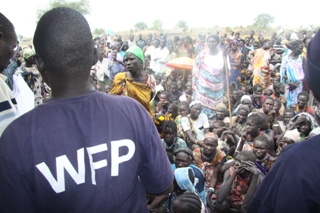 WFP Field Monitor Gabriel Ajak talking to people displaced in Pibor before the receive food aid. 20 Jan. 2012  (ST)