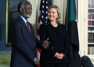 FILE - Sudanese Foreign Minister Ali Ahmed Karti (L) speaks as U.S. Secretary of State Hillary Clinton (R) looks on as they speak to the media January 26, 2011 at the State Department in Washington, DC. (AFP)