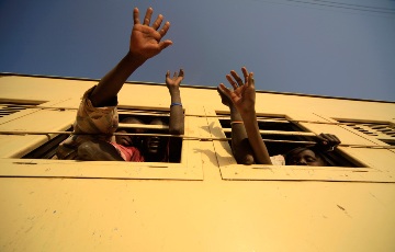 A Southern Sudanese family waves to relatives from a train to Baher Al Gazal State in South Sudan, in Khartoum January 9, 2011. Southern Sudanese are heading home to the south in such convoys, organized by humanitarian groups in the south, to ensure their vote counts in the independence referendum. (REUTERS/Mohamed Nureldin Abdallah)