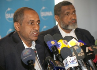 FILE - Head of Sudan's negotiating team Idris Abdul Gadir (L) speaks during a press conference (SUNA)