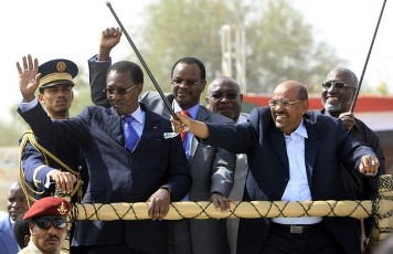 Sudanese president Omer Hassan al-Bashir and his Chadian counterpart, Idriss Deby, wave to the crowd after launching the Darfur Regional Authority in El Fasher, on 8 February 2012 (Photo: Reuters)