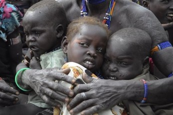 In this photo of Thursday, Jan.12, 2012, victims of ethnic violence in Jonglei, state, South Sudan, wait in line at the World Food Program distribution center in Pibor to receive emergency food rations. Tens of thousands fled their homes after ethnic violence erupted in Pibor county (AP)