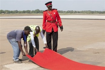 FILE - Employees of Juba International Airport lay a red carpet on the tarmac in preparation for the arrival of numerous foreign presidents and dignitaries, arriving in Juba, Sudan, to celebrate the independence of South Sudan as a country, Friday, July 8, 2011 (AP)