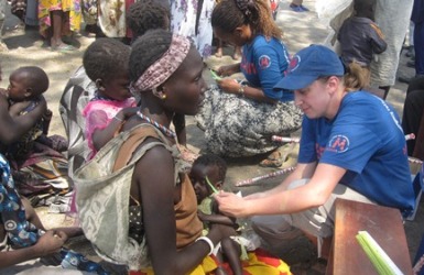 A MEDAIR medical worker attends to a malnourished child at a health unit in Pibor Boys Primary school, January 02, 2012 (Julius Uma/ST)