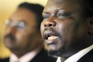Pagan Amum, (R) Secretary General of Sudan's People Liberation Movement (SPLM), speaks at a joint news conference in Khartoum August 30, 2010 (Reuters)