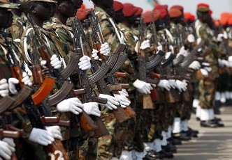 Sudan People's Liberation Army (SPLA) soldiers hold Ak-47 rifles (Reuters)