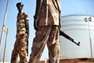 Soldiers guard a South Sudanese oil refinery, 2009 (AFP)