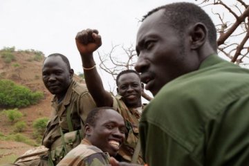 Soldiers of Sudan People's Liberation Movement's northern arm (SPLM) drive through South Kordofan in 2011 (AFP)