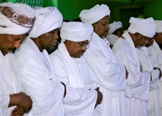 Sudan President Omar Hassan al-Bashir in prayer after winning national elections in 2010 (Reuters)