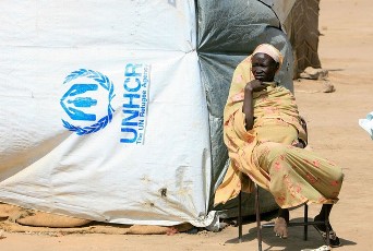 A Sudanese refugee woman looks on during a visit by Antonio Guterres, the United Nations High Commissioner for Refugees, to the Andalusia camp for internally displaced people from southern Sudan, some 30 kms south of the capital Khartoum, on January 11, 2012 (AFP)