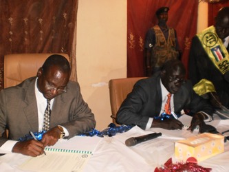 Unity State governor Taban Deng Gai right, speaker Simon Maguek Gai left signed the state transitional consitutionals on Friday in August house in Bentiu 10-02-2012 (ST)
