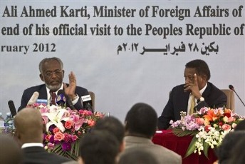 Sudanese Foreign Minister Ali Ahmed Karti, left, speaks as Ambassador to China Mirghani Mohamed Salih, right, look on during a news conference at the Sudan Embassy in Beijing, China, Tuesday, Feb. 28, 2012 (AP)