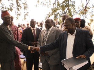 Vice president Riek Machar Teny shakes hand with a local chief in Mapel in Lakes State after showing document file of all peace agreements from 1999-2012 in the republic of South Sudan. February 18,2011 (ST)