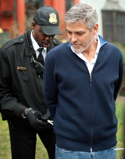 Actor and activist George Clooney is handcuffed by a member of the US Secret Service Uniform Divison for trespassing upon the Sudanese Embassy in Washington, DC, March 16, 2012.  (Getty)