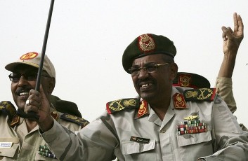 Sudanese President Omer Hassan al-Bashir (R) and defence minister Abdel Rahim Muhammad Hussein attend the Popular Defence Force rally in Khartoum March 3, 2012 (Reuters)