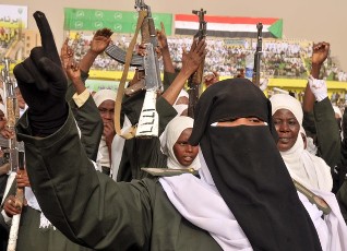 A female Sudanese solider cheers during a visit from Sudan's President Omer Hassan al-Bashir to the Popular Defence Forces in Khartoum on March 3, 2012 (EBRAHIM HAMID/AFP/Getty Images)