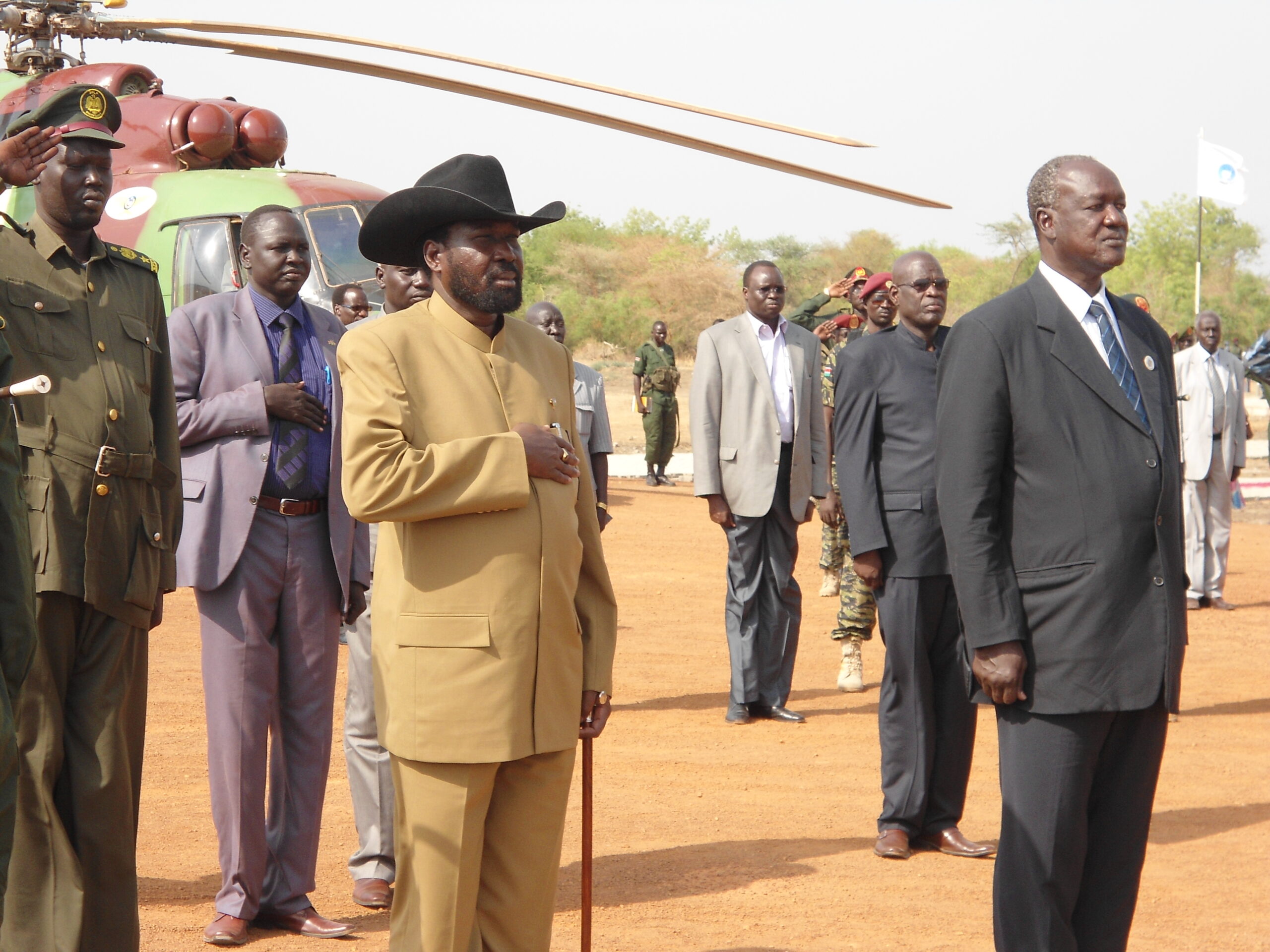 South Sudan President Salva Kiir with governor, Kuol Manyang listening to a band at Bor airstrip on arrival for the start of Jonglei's disarmament campaign. March 12, 2012 (ST)