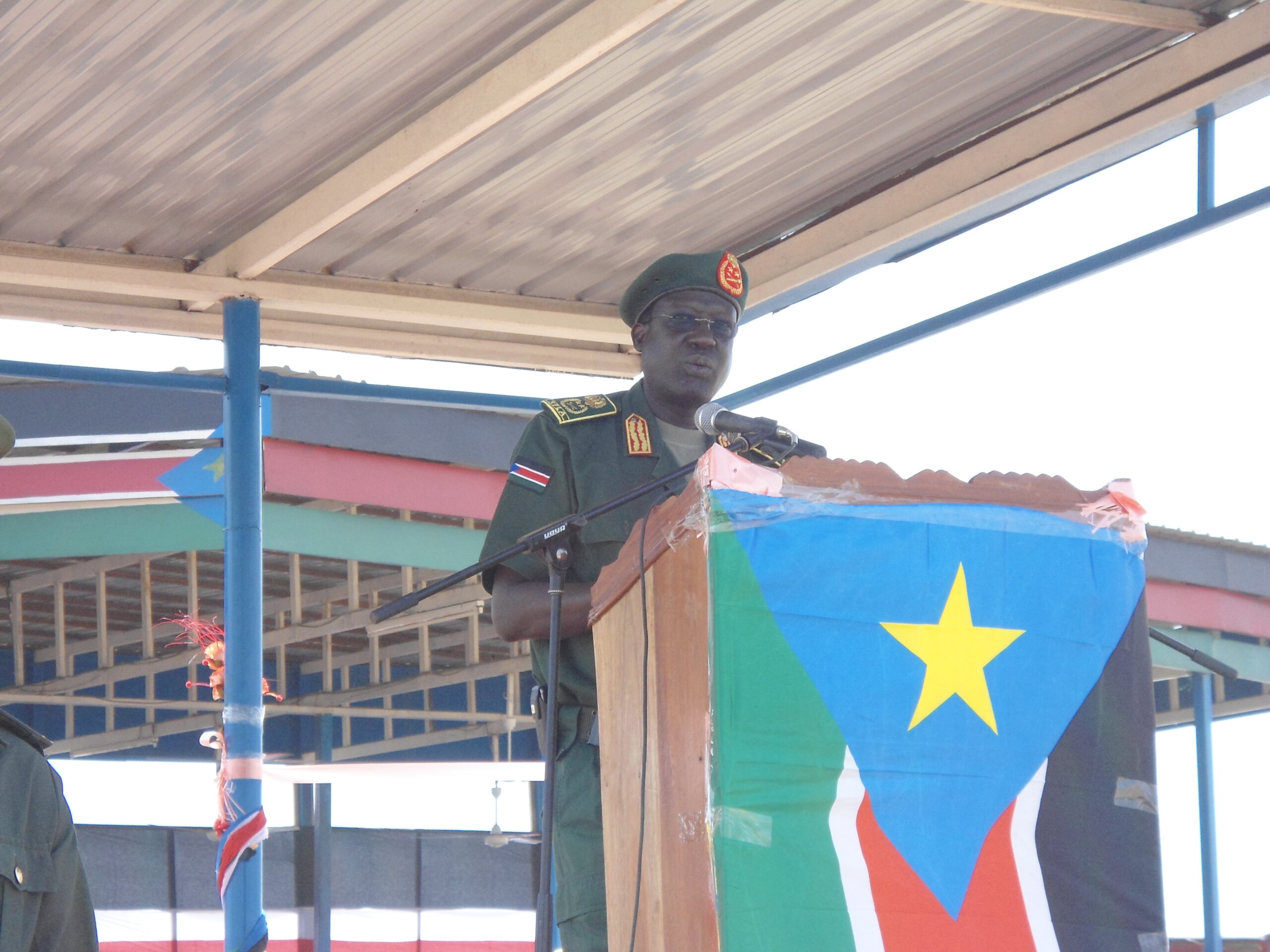 SPLA general chief of staff, James Hoth Mai, on the stage at the disarmament ceremony in Bor's freedom square, Jonglei State. March 12, 2012 (ST)