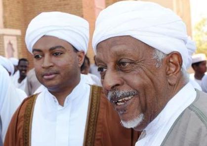 Democratic Unionist Party (DUP) leader Mohamed Osman al-Mirghani (R) and his son Jaafar who was given a presidential assistant position as part of a deal to join Sudan’s government