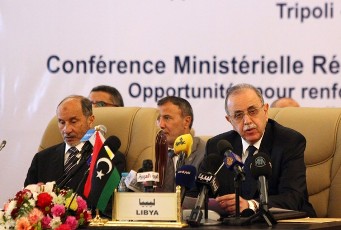 Libya's interim Prime Minister Abdel Rahim al-Kib (c) and National Transitional Council (NTC) chairman Mustafa Abdel Jalil chair the opening session a ministerial conference on regional cooperation in Tripoli on March 11, 2012 (AFP)