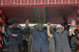 Presidents [L-R], Salva Kiir of South Sudan, Mwai Kibaki of Kenya and Meles Zenawi of Ethiopia raise their joined hands on March 2, 2012 during the ceremony of an ambitious port project in Kenya’s resort town of Lamu (GETTY)