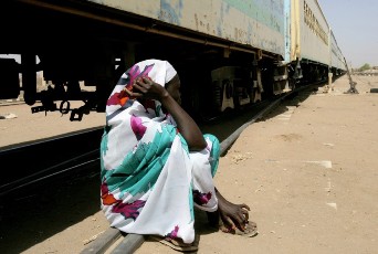 A South Sudanese woman waits to return home by a train organized by the International Organization for Migration (IOM) in Khartoum (AFP)