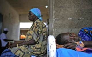 A woman at a health clinic in Terekeka, Central Equatoria state,where malaria is endemic, April 2, 2009 (AFP)