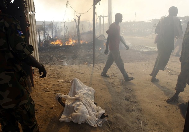 The burnt body of a boy killed during an air strike by the Sudanese air force is covered with sheets in a market in Rubkona near Bentiu April 23, 2012 (Reuters/ Goran Tomasevic)