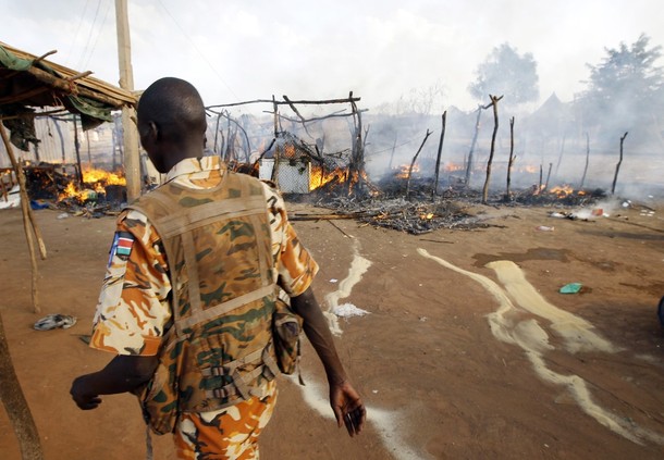A SPLA soldier walks in a market destroyed in an air strike by the  Sudanese air force in Rubkona near Bentiu April 23, 2012 (Reuters/ Goran Tomasevic)