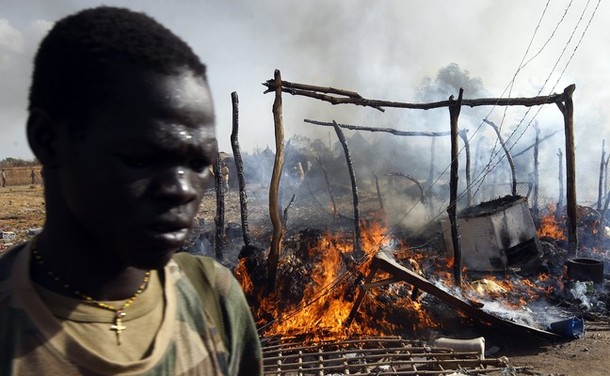 A SPLA soldier walks in a market destroyed in an air strike by the  Sudanese air force in Rubkona near Bentiu April 23, 2012 (Reuters/ Goran Tomasevic)