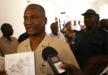 Unity State Governor Taban Deng Gai showing a map of the areas bombed by the Sudan Armed Forces (SAF) to a group of journalists in Bentiu town. 5 April 2012 (ST)