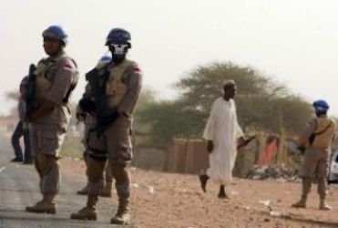 Members of the Indonesian peacekeeping force from the UNAMID stand guard at ZamZam camp for internally displaced people in Al Fasher, northern Darfur April 13, 2010. (Reuters)