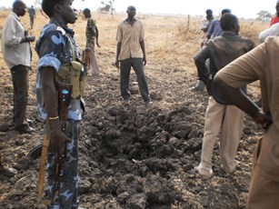 Police inspecting the bombsite in Thaon village near Bentiu, Unity state, South Sudan, April 12, 2012 (ST)