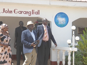 South Sudan's VP, Riek Machar (left) and Jonglei state governor, Kuol Manyang (right) leaving Bor conference hall, Jonglei, April 3, 2012 (ST)