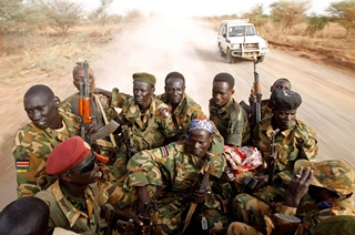 Sudanese Peoples Liberation Army (SPLA) soldiers drive in a truck on the frontline in Panakuach on April 24. (Goran Tomasevic / Reuters)