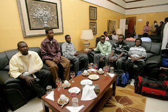 Sudanese soldiers, who were held as prisoners of war in South Sudan, sit upon arrival at Khartoum airport overnight on April 26, 2012 (GETTY)