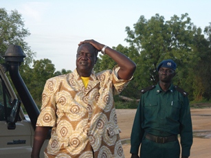 The Jonglei state governor, Kuol Manyang Juuk watching vehicles struggling to cross the flooded road in Bor, 17 May, 2012 (ST)