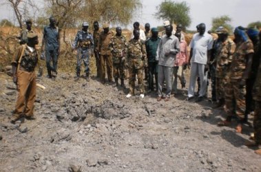 Rubkotna Commissioner William Gatjang assesing the crator of what South Sudan’s says was an Antenov bomb dropped by the Sudan Armed Forces. May 7, 2012 (ST)
